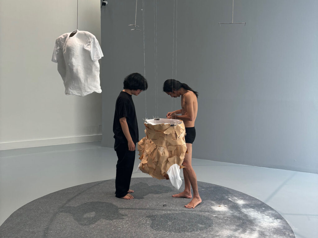 Moe Satt, ‘Body Inside T-shirt’, 2024. Sculpture-making process on day two of the durational performance at the Bangkok Art Biennale 2024. Image courtesy of Alessandra Dias