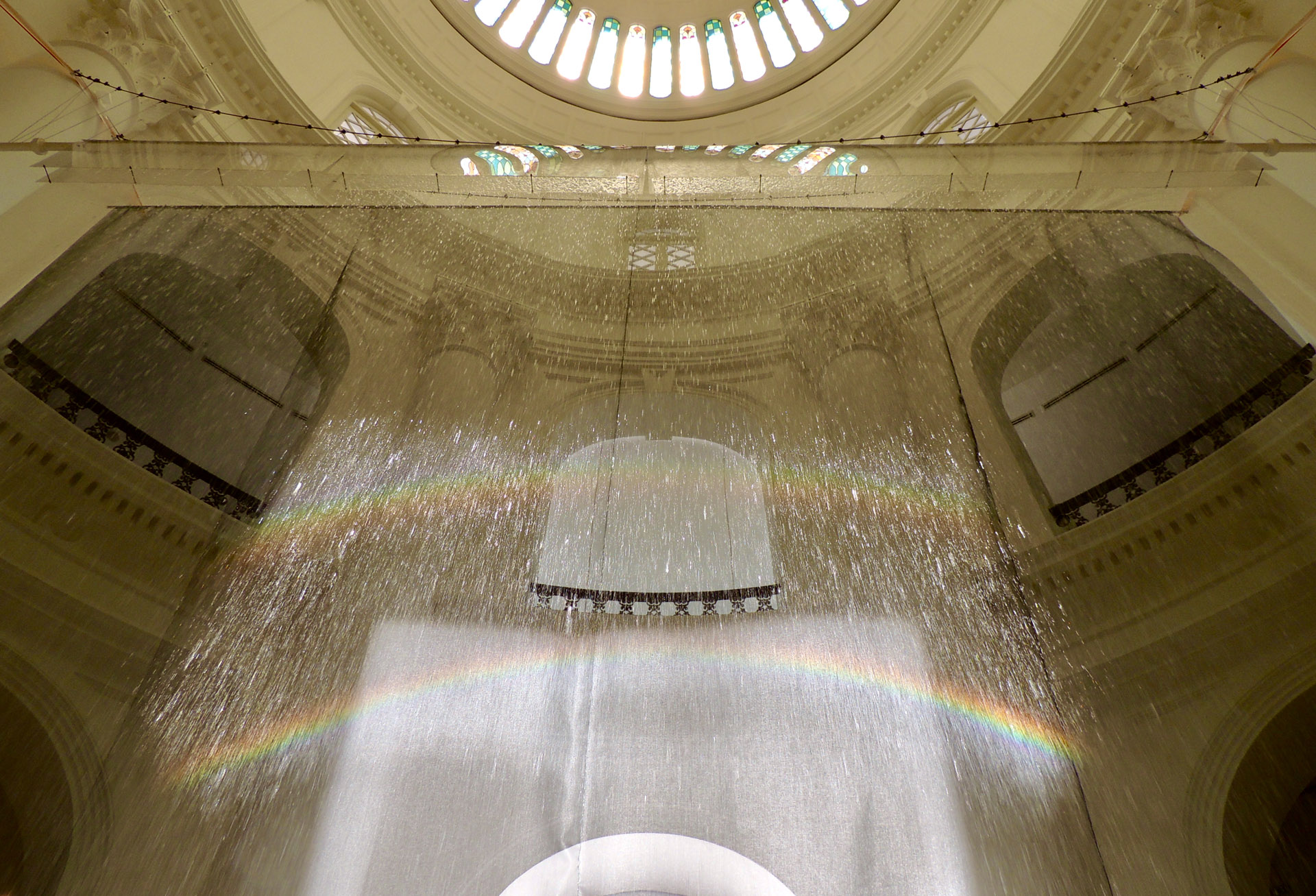 Suzann Victor, ‘Rainbow Circle’, 2013 (double rainbows), equatorial sunlight, water, trough, heliostat (solar tracking software, mirror, weather station, pipe). Singapore Biennale 2013. Image courtesy of the artist.