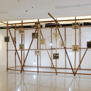 Mark Salvatus, ‘Off-grid’, 2022, installation with Collage, coconut lumber, and light bulbs. Image from the artist’s website