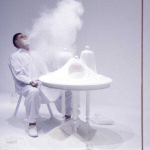 Ezzam Rahman, 'Allow me to introduce myself', 2015, talcum powder, second hand furniture, and glass bell jars, performance art. Image from Artsy