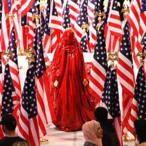 Anida Yoeu Ali, Performance Still, 'The Red Chador: Threshold', Smithsonian Arts & Industries Building, Washington D.C., 2015, Image courtesy of the artist